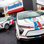 Domino's is rolling out more than 800 custom-branded 2023 Chevy Bolt electric vehicles at select stores throughout the U.S., making it the largest electric pizza delivery fleet in the country.